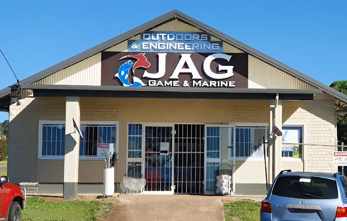Building with 'JAG Game & Marine' sign on a clear day